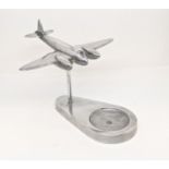 Trench Art Interest - A chromium desk top model of a Mosquito with ashtray base, 17cm wingspan
