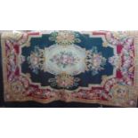 Hand stitched needlepoint panel with central cartouche surrounded by floral borders, 180 x 114cm (1)