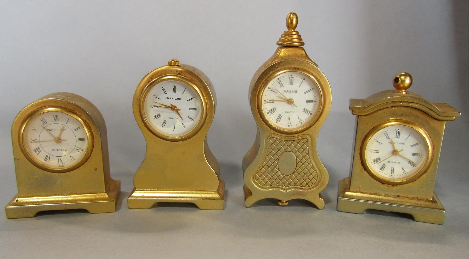 A collection of fourteen miniature brass cased mantel clocks of varying design by Park Lane, - Image 2 of 2