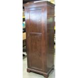 An Edwardian mahogany sentry box hall robe enclosed by a full length rectangular moulded panelled