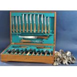 A cased canteen of stylised teak handled flatware together with a further collection of fiddle