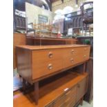 A retro long and low teak veneered dressing table fitted with a side by side arrangement of six