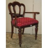 A Victorian style mahogany elbow chair with scrolled arms and upholstered seat and a further painted