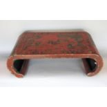 Chinese red lacquer opium/occasional table raised on convex support with detail showing
