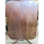 A Regency mahogany tilt top breakfast table of rectangular form with rounded corners and reeded