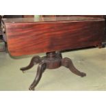 A Regency mahogany drop leaf Pembroke breakfast table fitted with one real and one dummy end