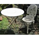 A Victorian style cream painted, cast aluminium garden chair, with decorative pierced foliate and