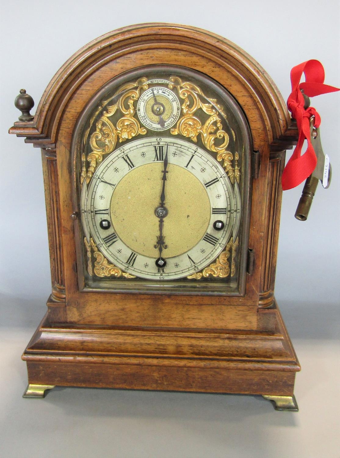 A 19th century walnut bracket clock enclosing a three train German movement with regulator, the