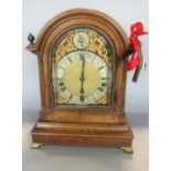 A 19th century walnut bracket clock enclosing a three train German movement with regulator, the
