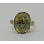 Antique yellow metal foiled citrine ring in raised collet setting, size N/O, 4.8g