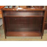 A reproduction mahogany dwarf freestanding open bookcase, the front elevation with moulded
