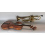 A students violin and a vintage brass trumpet