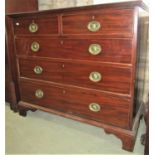 A Georgian mahogany bedroom chest of two short over three long graduated drawers with inlaid