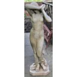 A reclaimed garden statue in the form of a classical scantily draped shy maiden, 115cm high