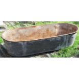 A vintage galvanized tin two handled bath with shaped ends (af)