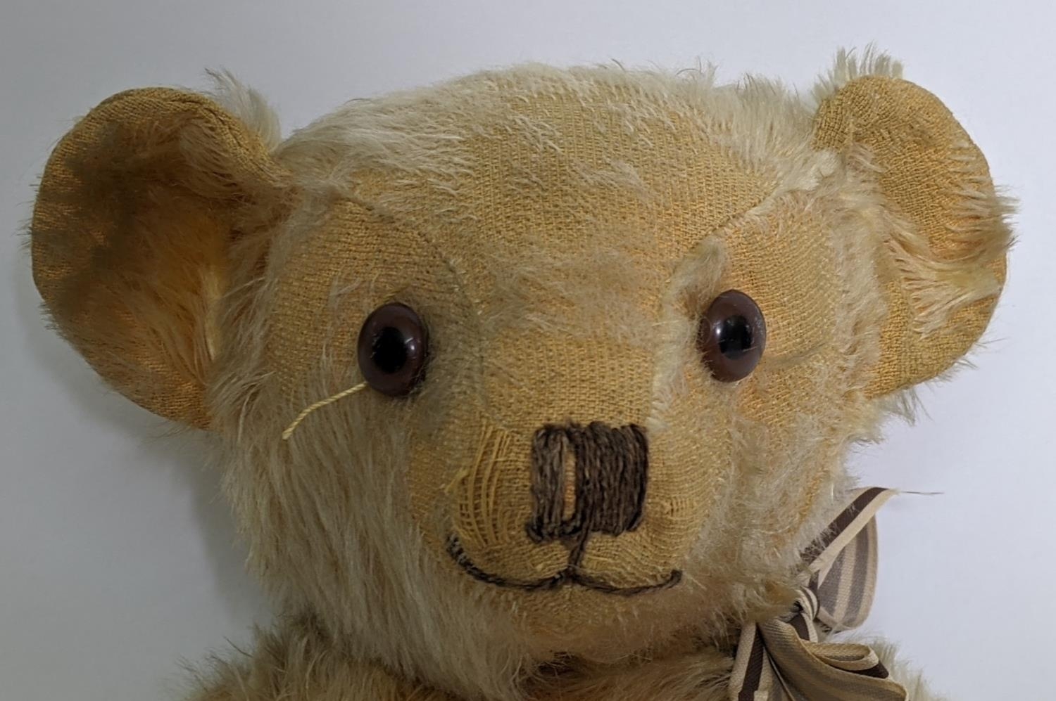 1930's teddy bear possibly by Merrythought with golden mohair, slight humped back, glass eyes, - Image 2 of 5