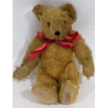 Small 1930's teddy bear 'A Farnell Alpha toy' with golden plush fur and jointed body, pronounced