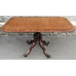 A Regency mahogany tilt top breakfast table of rectangular form with rounded corners and ebonised