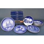A collection of nine Royal Copenhagen blue and white printed Christmas plates from the 70s, 80s