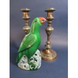 An oriental green glazed model of a parrot raised on a rocky outcrop, 23.5cm tall approx, together