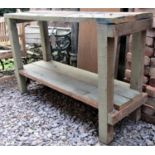 A rustic pine workshop work bench, 142cm long x 46cm wide, together with a folding trestle table