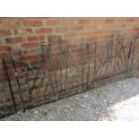 A pair of art deco style iron work entrance gates, with open stepped tapered and diagonal bars