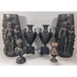 A pair of resin bronze effect oviform vases with repeating geometric detail, a similar figure in the