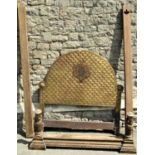 A gilt wood single bedstead the arched and scrolled headboard with repeating scale design and