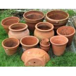 One lot of outsized terracotta flowerpots and planters, of varying size and design