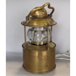 A good quality heavy brass marine lantern - circular, fitted with a clear glass lens and rising/fall