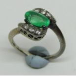 Emerald and diamond crossover ring for re-setting, the oval emerald weighs 0.27g and measures 8L x