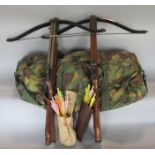 2 rifle cross bows together with a camouflage bag containing items of military uniform