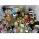 Large quantity of unboxed empty perfume bottles by various designers including Dior Addiot, Yves