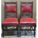 A set of four late Victorian/Edwardian walnut dining chairs labelled Edwards & Roberts, the