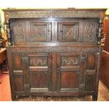 A very original, early 18th century court cupboard, the lower section enclosed by a pair of panelled