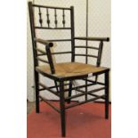 Phillip Webb for William Morris Sussex chair, with turned spindles and rush seat