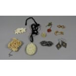 Group of antique jewellery to include a carved bone rose brooch in white metal mount, carved ivory