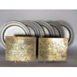 A pair of brass printing plates after Breughal showing scenes of mediaeval torture and the