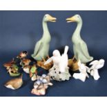A pair of Chinese models of ducks with celadon type glaze, together with a Royal Copenhagen group of