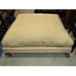 A good quality square cut upholstered stool or centre seat, 122 cm square with loose cushion,