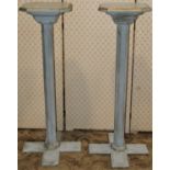 A pair of pine torcheres with painted finish, octagonal columns and cruciform moulded platform
