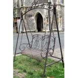 A contemporary tubular steel framed chain hung two seat garden swing, with shaped and pierced