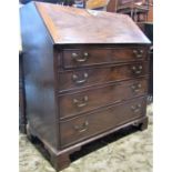 A Georgian mahogany bureau, the fall flap enclosing a simply fitted interior of small drawers and