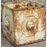 A weathered cast iron square garden planter with repeating raised lions mask detail, 28 cm square