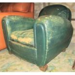 A pair of Art Deco club armchairs upholstered in original green ground leather - for restoration