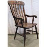 A Windsor lathe back elbow chair in elm and beech