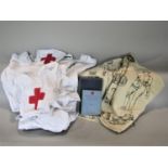 A mixed lot comprising a Hobson & Sons of London nurses white apron for The British Red Cross,