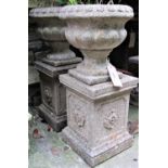 A pair of reclaimed garden planters, probably Sandford stone with flared repeating flowerhead