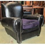 A substantial drawing room chair upholstered in black leather (af)