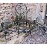 A heavy gauge ironwork single hoop back garden chair with circular pierced lattice seat, together